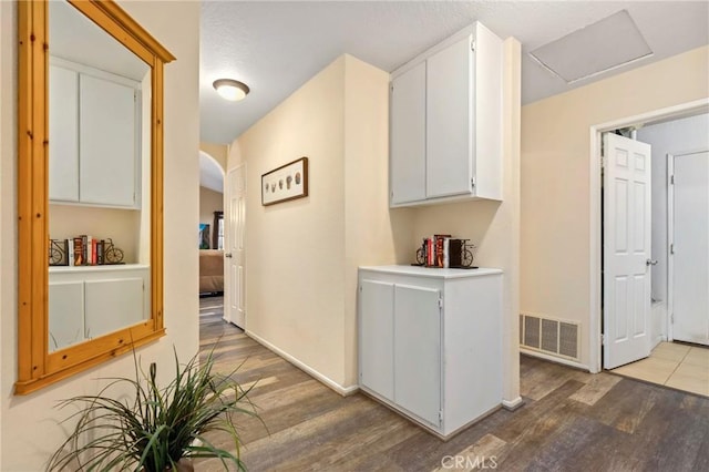 corridor featuring hardwood / wood-style flooring