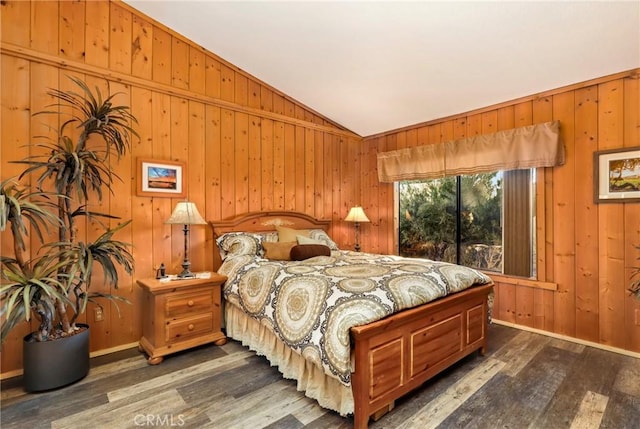 bedroom with lofted ceiling and dark hardwood / wood-style flooring