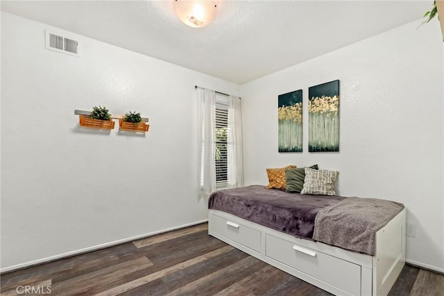 bedroom featuring dark hardwood / wood-style floors