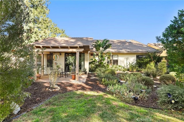 back of property with a patio area