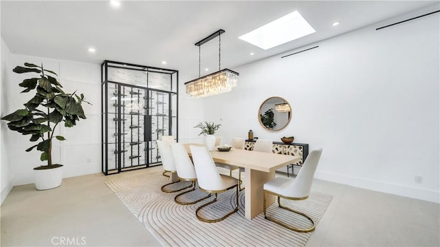 dining space featuring a skylight