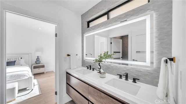 bathroom with vanity and hardwood / wood-style flooring