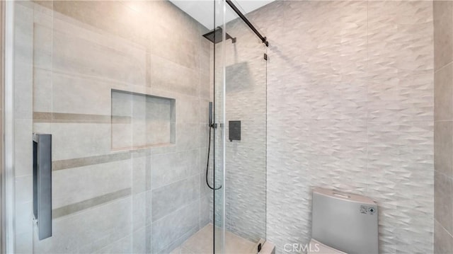 bathroom with a shower with shower door