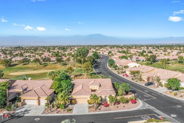 birds eye view of property with a mountain view