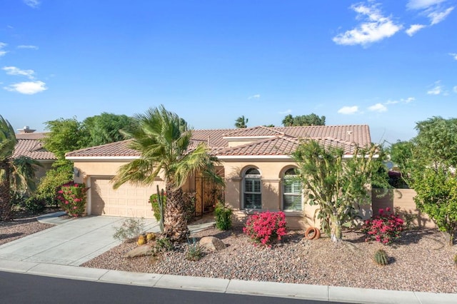 mediterranean / spanish-style house featuring a garage