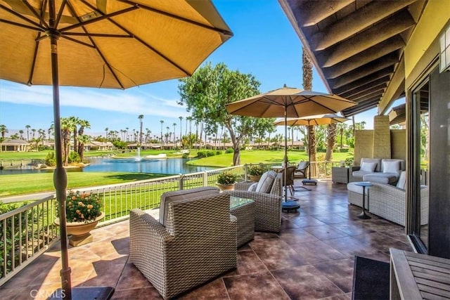 view of patio / terrace with outdoor lounge area and a water view