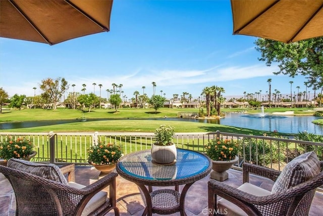 view of patio with a water view