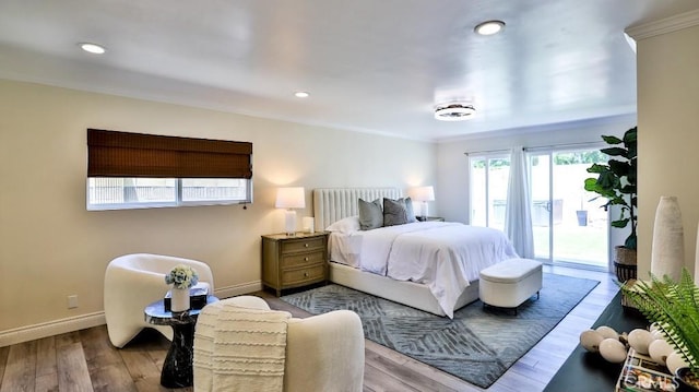 bedroom with access to outside, crown molding, and light hardwood / wood-style flooring