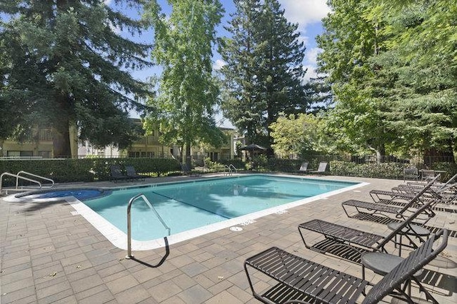 view of pool featuring a patio