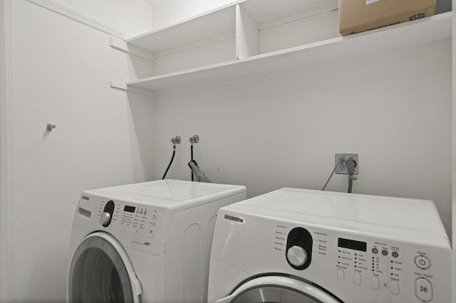 clothes washing area with independent washer and dryer