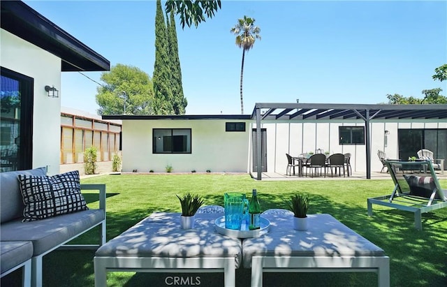 rear view of house featuring a patio, a yard, and a pergola