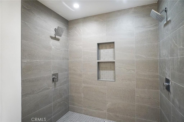 bathroom with tiled shower