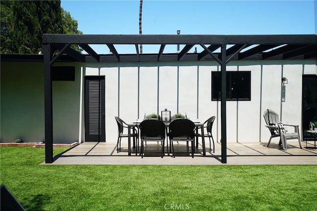 rear view of house with a yard and a patio