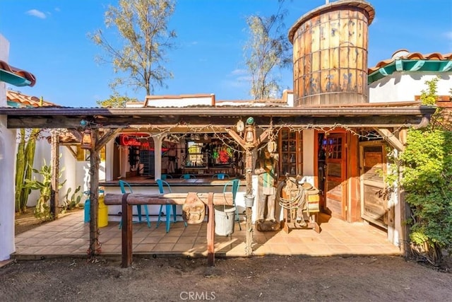 rear view of house featuring a patio area