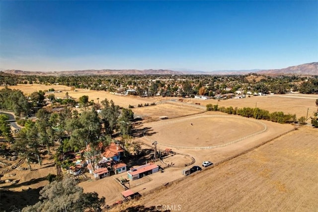 birds eye view of property with a mountain view