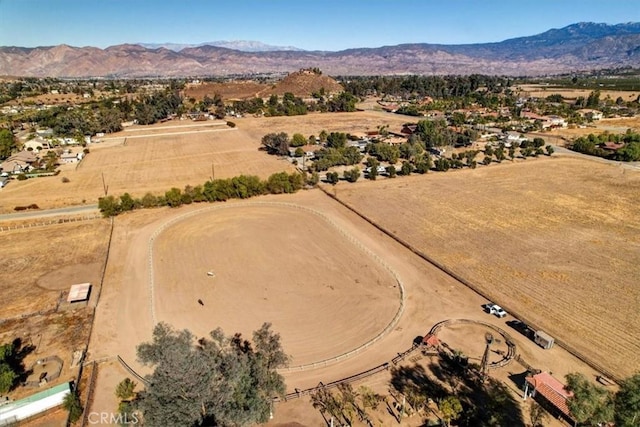 birds eye view of property with a mountain view