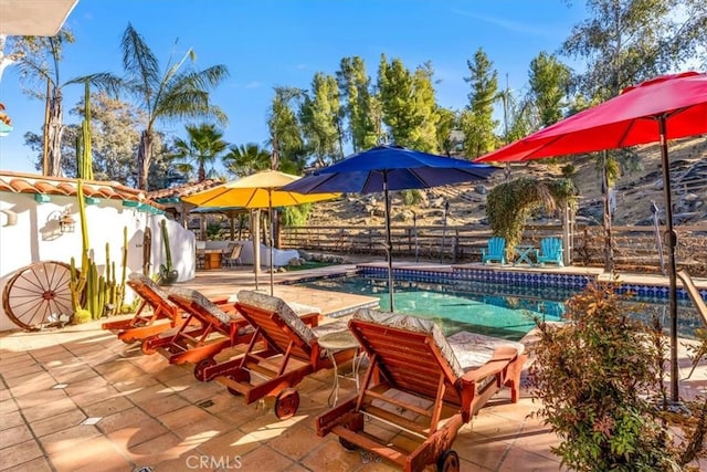 view of pool featuring a patio