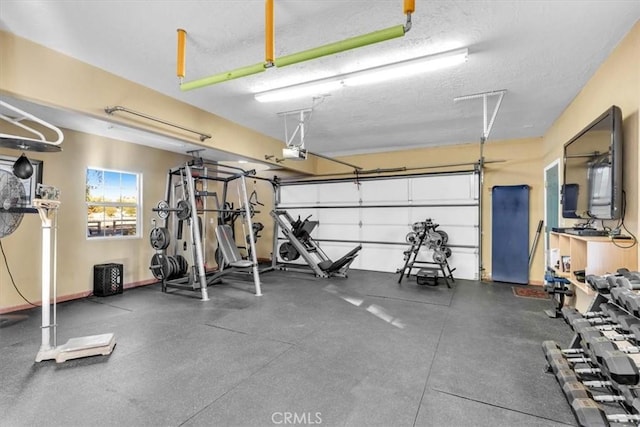 gym featuring a textured ceiling