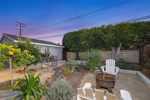 patio terrace at dusk with an outdoor fire pit