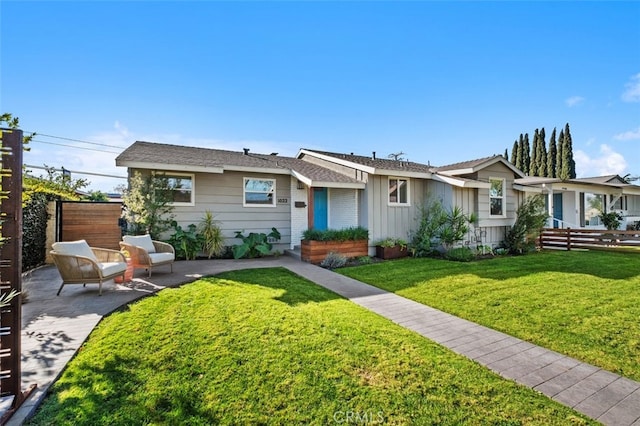 ranch-style home with a patio and a front yard