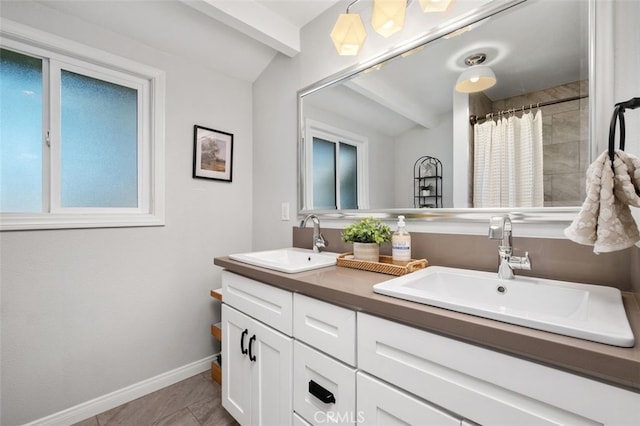 bathroom with tile patterned flooring, curtained shower, lofted ceiling with beams, and vanity