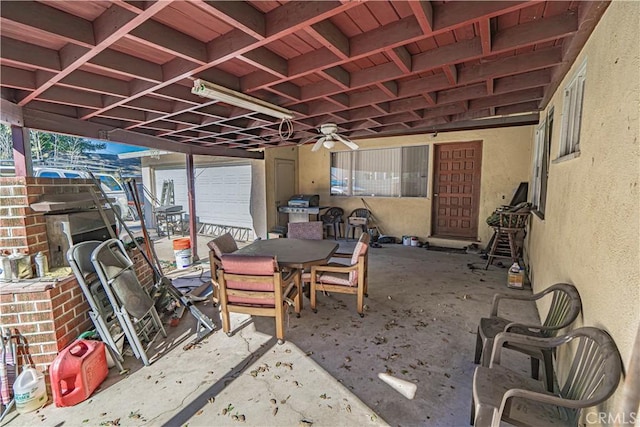 view of patio featuring ceiling fan