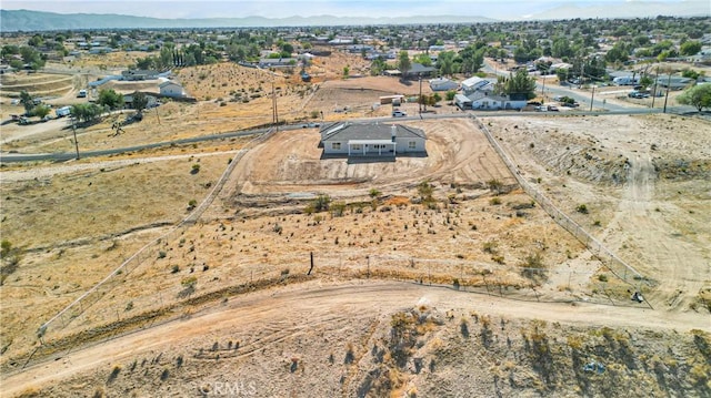 birds eye view of property featuring a mountain view