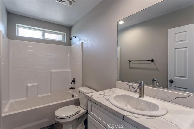 full bathroom with toilet, washtub / shower combination, and vanity