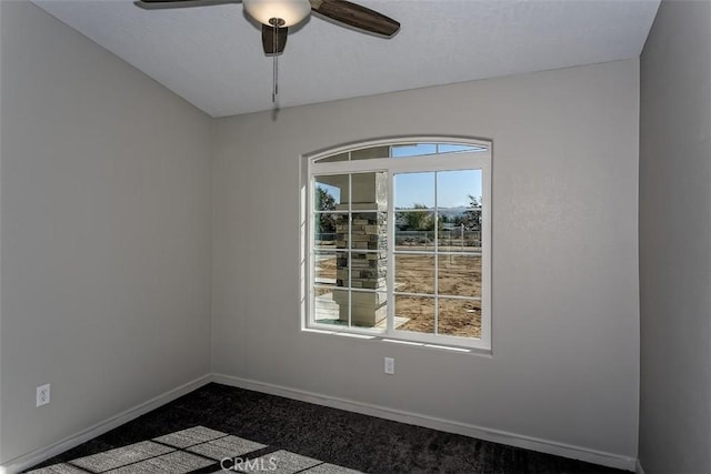 carpeted empty room with ceiling fan