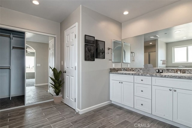 bathroom with vanity and ceiling fan