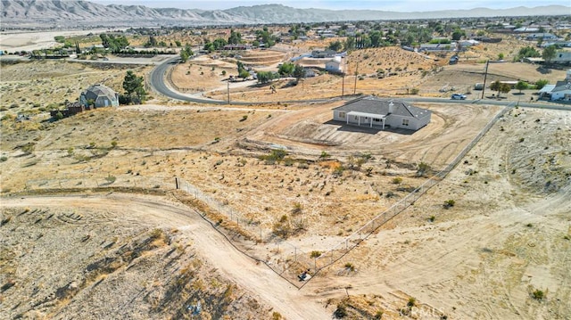 birds eye view of property featuring a mountain view