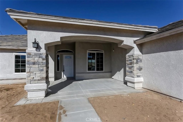 property entrance with a patio