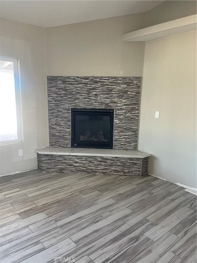 interior details with a fireplace and hardwood / wood-style floors