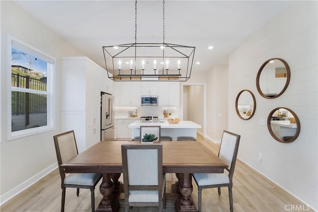 dining space featuring light wood-type flooring