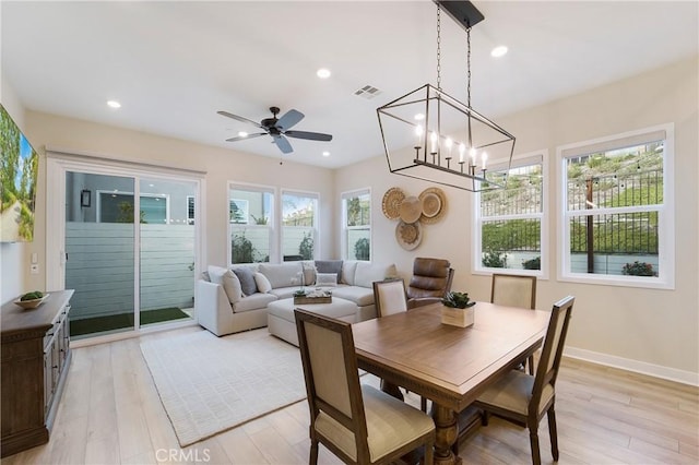 dining area with ceiling fan and light hardwood / wood-style flooring