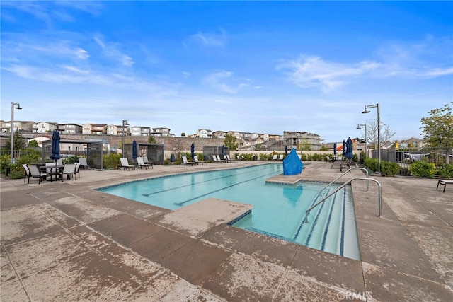 view of swimming pool featuring a patio area