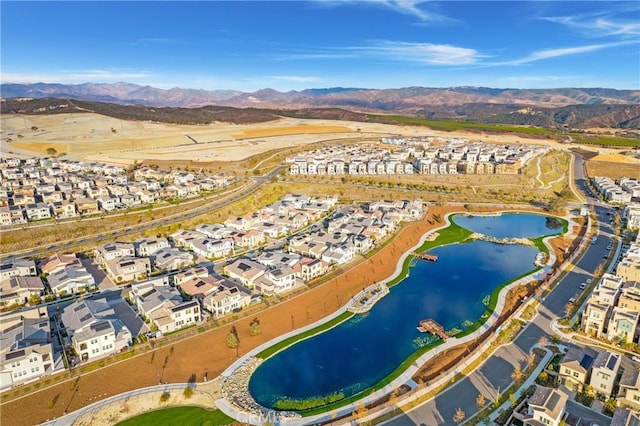 bird's eye view featuring a water and mountain view