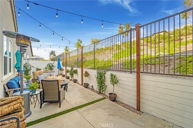 view of patio / terrace with a fire pit