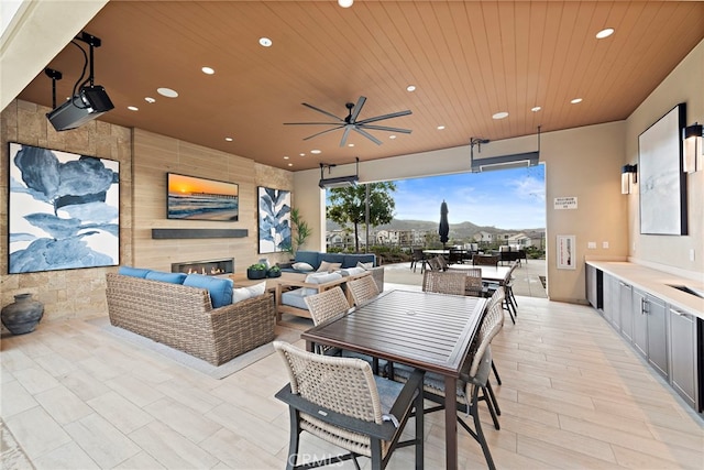 view of patio with ceiling fan and an outdoor hangout area