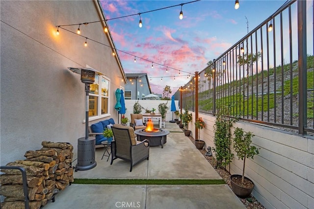 patio terrace at dusk with an outdoor fire pit