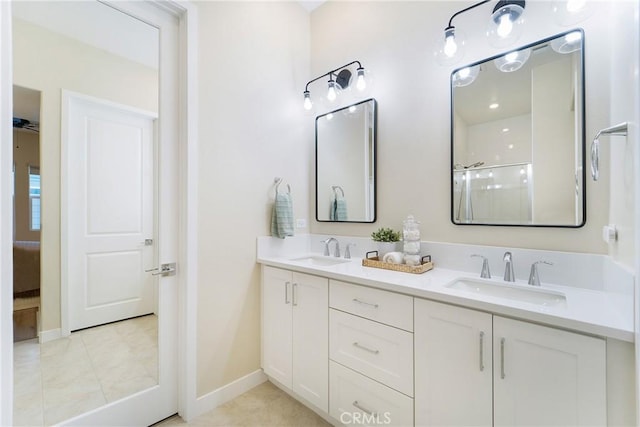 bathroom with vanity, an enclosed shower, and tile patterned floors