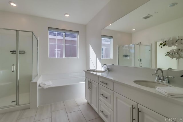 bathroom with vanity, tile patterned floors, and separate shower and tub