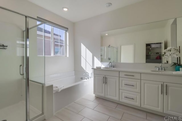 bathroom with vanity, tile patterned flooring, and separate shower and tub