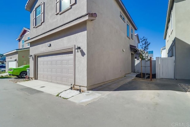 view of property exterior with a garage