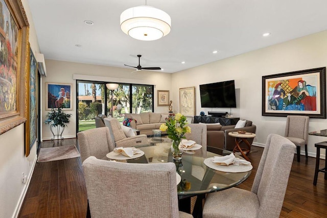 dining area with ceiling fan and dark hardwood / wood-style flooring