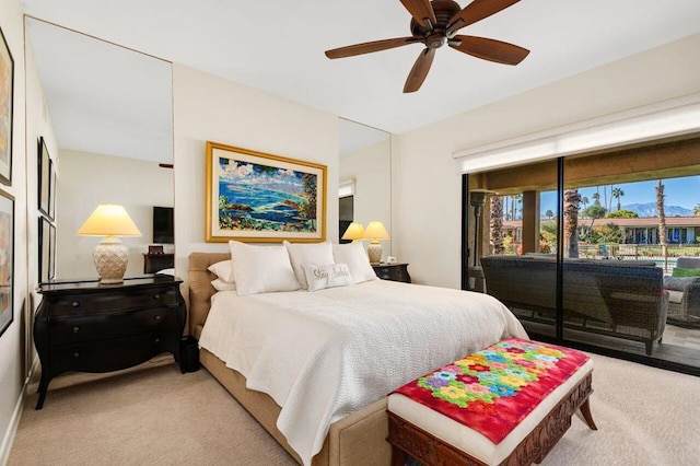 carpeted bedroom with ceiling fan and access to exterior