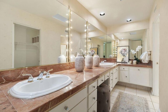 bathroom with tile patterned floors and vanity