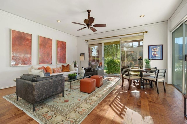 living room with ceiling fan, hardwood / wood-style floors, and ornamental molding