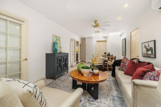 living room featuring ceiling fan and a wall mounted AC