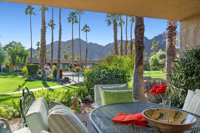 exterior space featuring a mountain view and a community pool